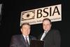 Security Management Today’s Editor Brian Sims (right) receives the BSIA Chairman’s Award for 2005 from Jim Harrower.