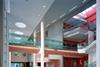 Visitors to the Central Middlesex Hospital are welcomed by a radiant and spacious atrium with a prominent reception desk and malls leading off in four directions.