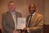 Martin Fahey, newly elected member of the CIBSE East Midlands Regional Committee, receives his much-deserved prize from Chairman Densel.