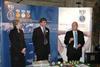 Theresa May, the NSI's Tom Mullarkey, and Paul Goggins at the launch event