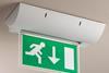 Cooper’s Safe Edge exit sign pivots through a wide arc and has a lit edge