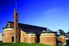 St Brigid’s Church in Belfast was designed by Kennedy Fitzgerald Associates. Completed in 1994, it replaced a church dating from 1893. The brick built church has a pitched slate roof and seats 800 people.