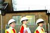 Local schoolchildren on a Carillion site visit – complete with oversized high-vis vests