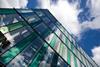 Blue and green coloured panels integrated into the fully-glazed facade help to creae a recognisable brand for the Idea Store.