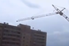 A crane crashes into a Russian housing development