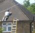 Man leaning on roof