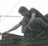 Man on roof in Romford, Essex
