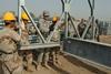 American soldiers teaching bridge building in Iraq