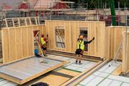 Construction Workers Installing Wall Panel
