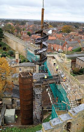 The 9-tonne Corten spiral stair had to be hoisted into place over the castle walls