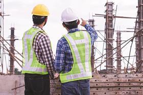 Two construction workers with back to camera