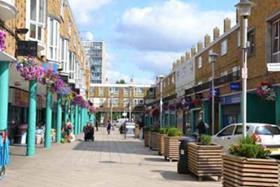 Shops and homes on Market Way at Chrisp Street Market in east London