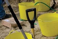 yellow buckets on the beach