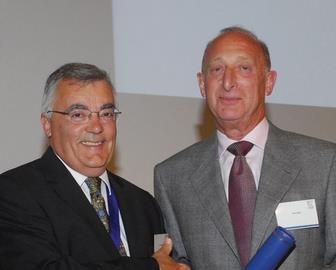 Brian Moss (right) receives the Gold Medal award from CIBSE past-president John Armstrong 