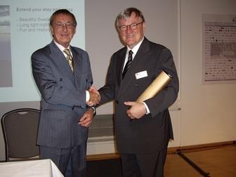 Peter Hoyle (left) is congratulated on his assumption of the GCI-UICP presidency by his predecessor, Jurgen Diehl of Germany