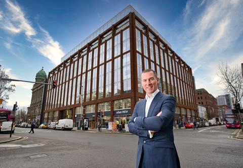 Ray Hutchinson, Managing Director of Gilbert-Ash, stands in front of Merchant Square (1)