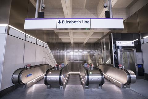 The top of the escalators at the new Farringdon Station with a sign saying Elizabeth Line