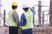 Two construction workers with back to camera