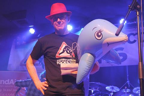 Construction Rocks Bill Price and an inflatable dolphin