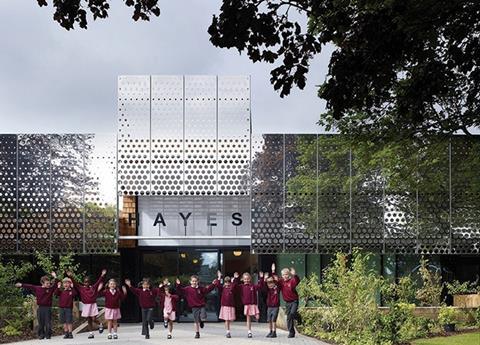 A new polished stainless steel screen unifies an expanded Hayes Primary School