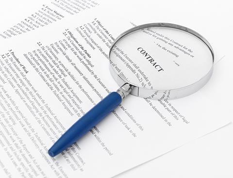 Magnifying glass on a contract