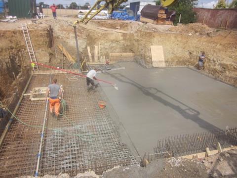 This waterproof concrete floor slab has been pokered and levelled, then power-floated to screed rails with the vibrating tamp and finished with an Easi-float