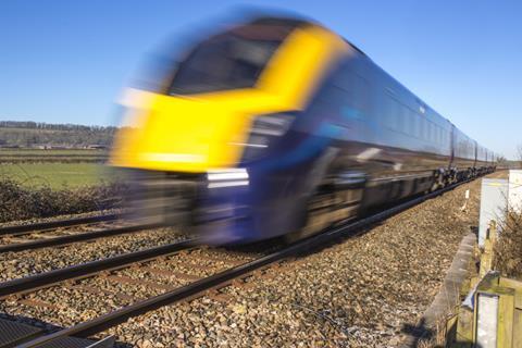 Train speeding through the UK countryside