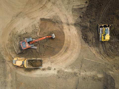 Aerial shot of construction including multiple heavy machinery