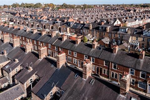 Aerial view of old terraced houses on back to back streets in the suburbs of a large UK city in the North of England