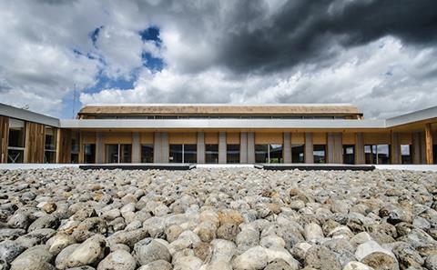 While the Enterprise Centre’s outer facades are heavily insulated with thatch, inner courtyard elevations feature timber cladding and large windows to admit daylight