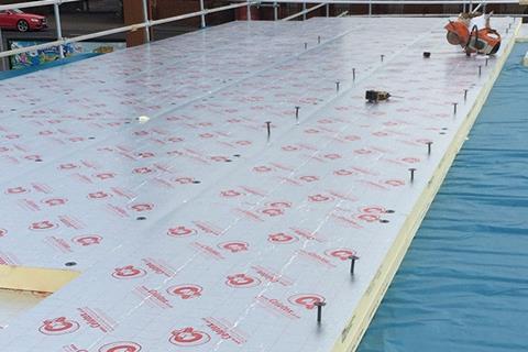 Celotex insulation is added to a new flat roof installation