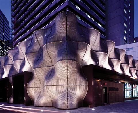 Boiler Suit, Guy’s hospital, is encased in 108 curved panels of woven, perforated metal, which create an undulating surface that entirely conceals the flat concrete box underneath