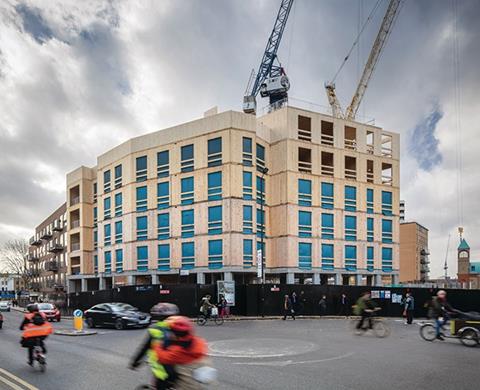 The development consists of a six-storey residential block, a four-storey office and a 10-storey residential tower, which will be the tallest CLT building in the world when it completes later this year. The scheme sits on a concrete podium, needed for the