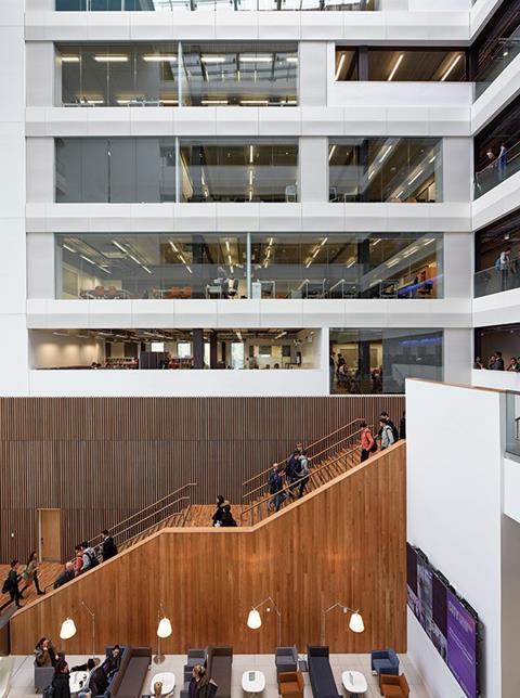 The atrium features a timber ceremonial staircase