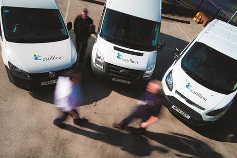 Three vans branded with Carillion logo