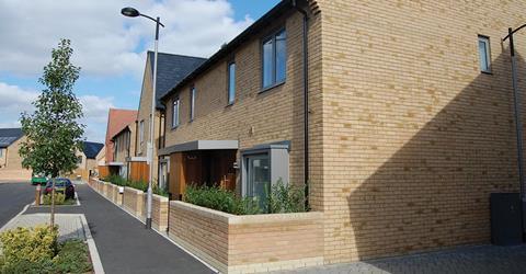 Trumpington Meadows in Cambridge by Allies and Morrison and Barratt Homes features cleverly integrated parallel parking bays sheltered by landscaping