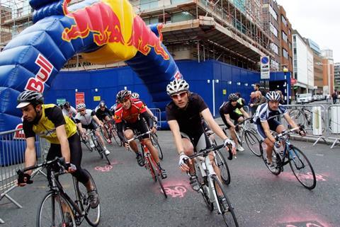 Riders turn the final bend past the Farringdon Crossrail site