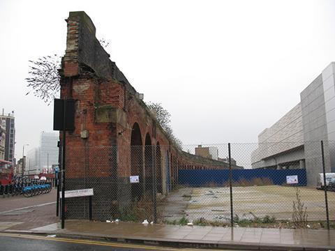The outer brick wall of Bishopsgate goods yard, left standing alongside Bethnal Green Road