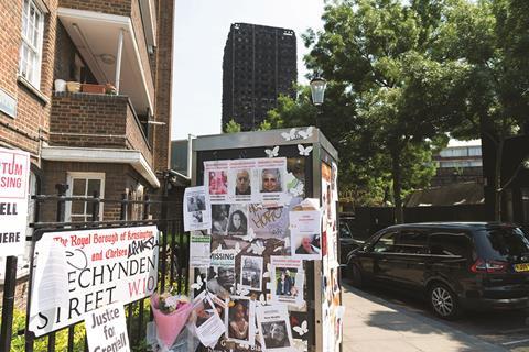 Floral tributes and missing person posters left on a street corner in the London Borough of Kensington and Chelsea after the Grenfell Tower fire