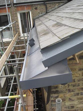 Fitting the gutter and flashing on a Passivhaus refurbishment