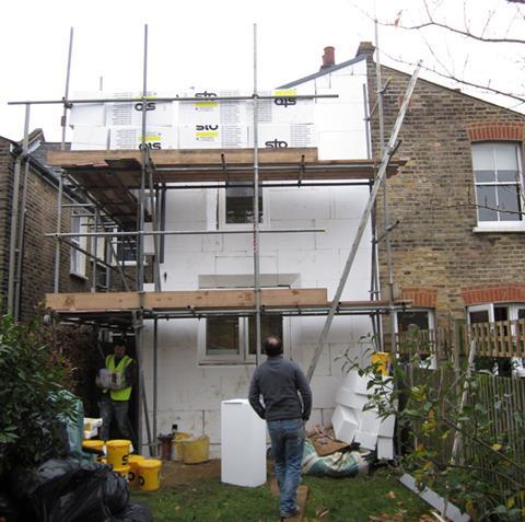 Insulation being fitted on Passivhaus refurbishment in Hackney