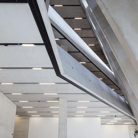 Three of the five gallery levels that occupy the base of the building are linked by splayed and chasm-like floor openings that reflect the geometry of the extension