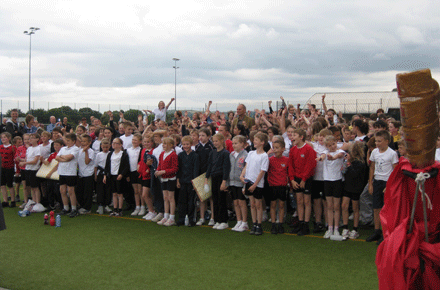 Pupils celebrating the end of the inter-schools sports event at Darton College with Sir Steve Redgrave